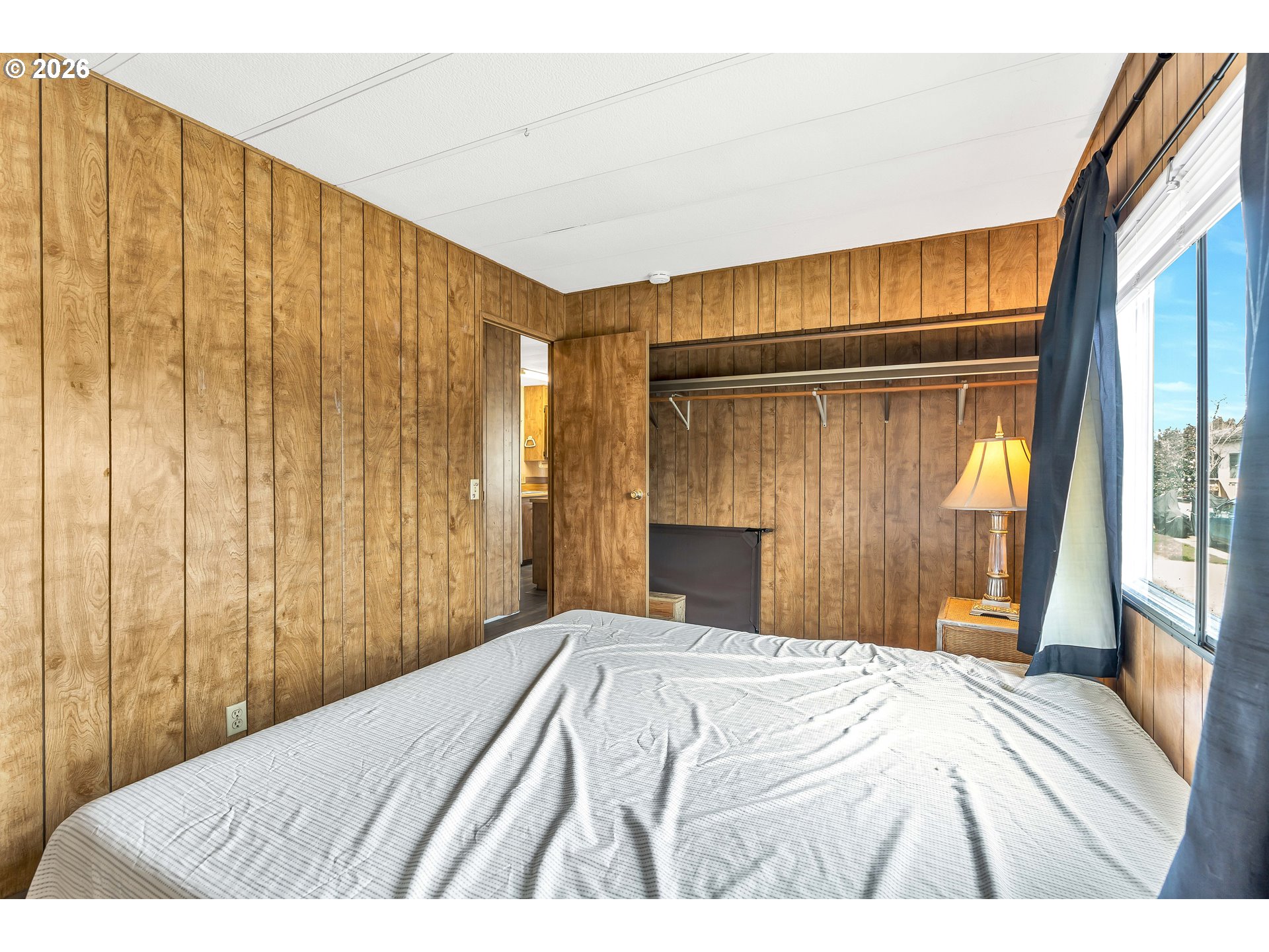 4783 Joyce Street, Unit 93 Keizer, OR 97303 - Photo 17 of 33 a bedroom with a bed and a window