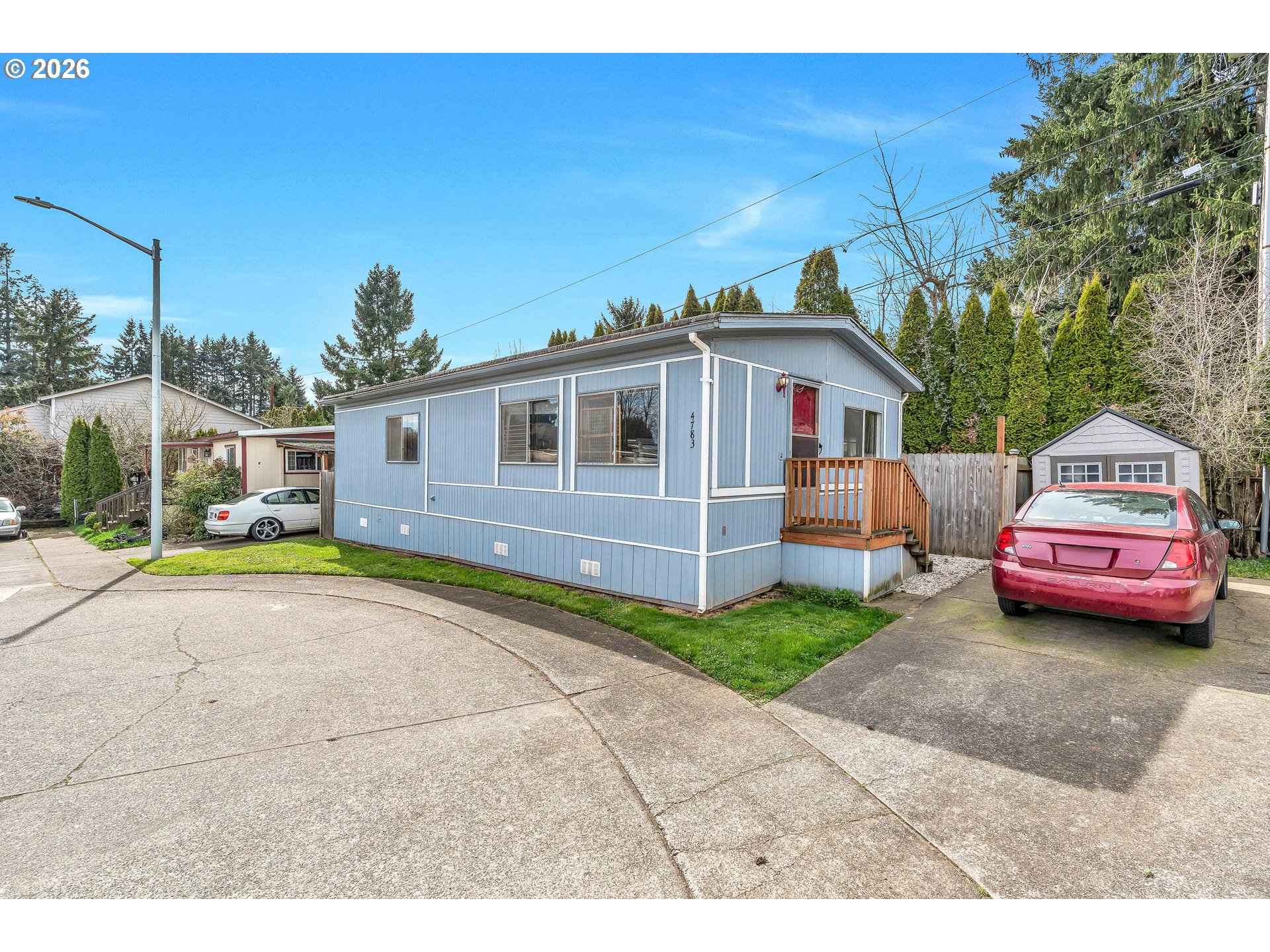 4783 Joyce Street, Unit 93 Keizer, OR 97303 - Photo 2 of 33 a front view of a house with a garden and garage