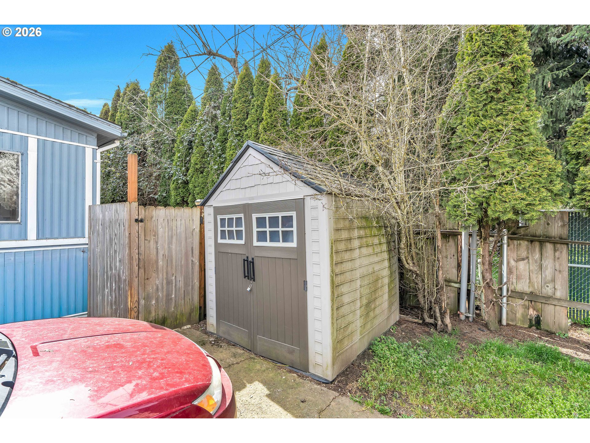 4783 Joyce Street, Unit 93 Keizer, OR 97303 - Photo 27 of 33 a view of a wooden door and a yard