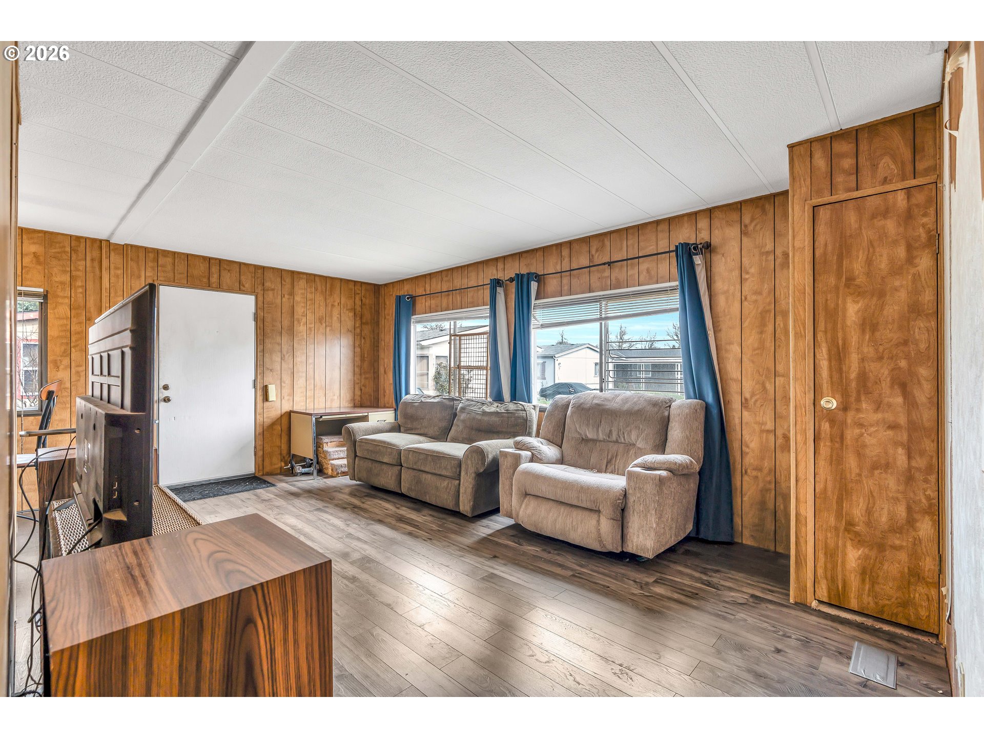 4783 Joyce Street, Unit 93 Keizer, OR 97303 - Photo 7 of 33 a living room with furniture and a flat screen tv