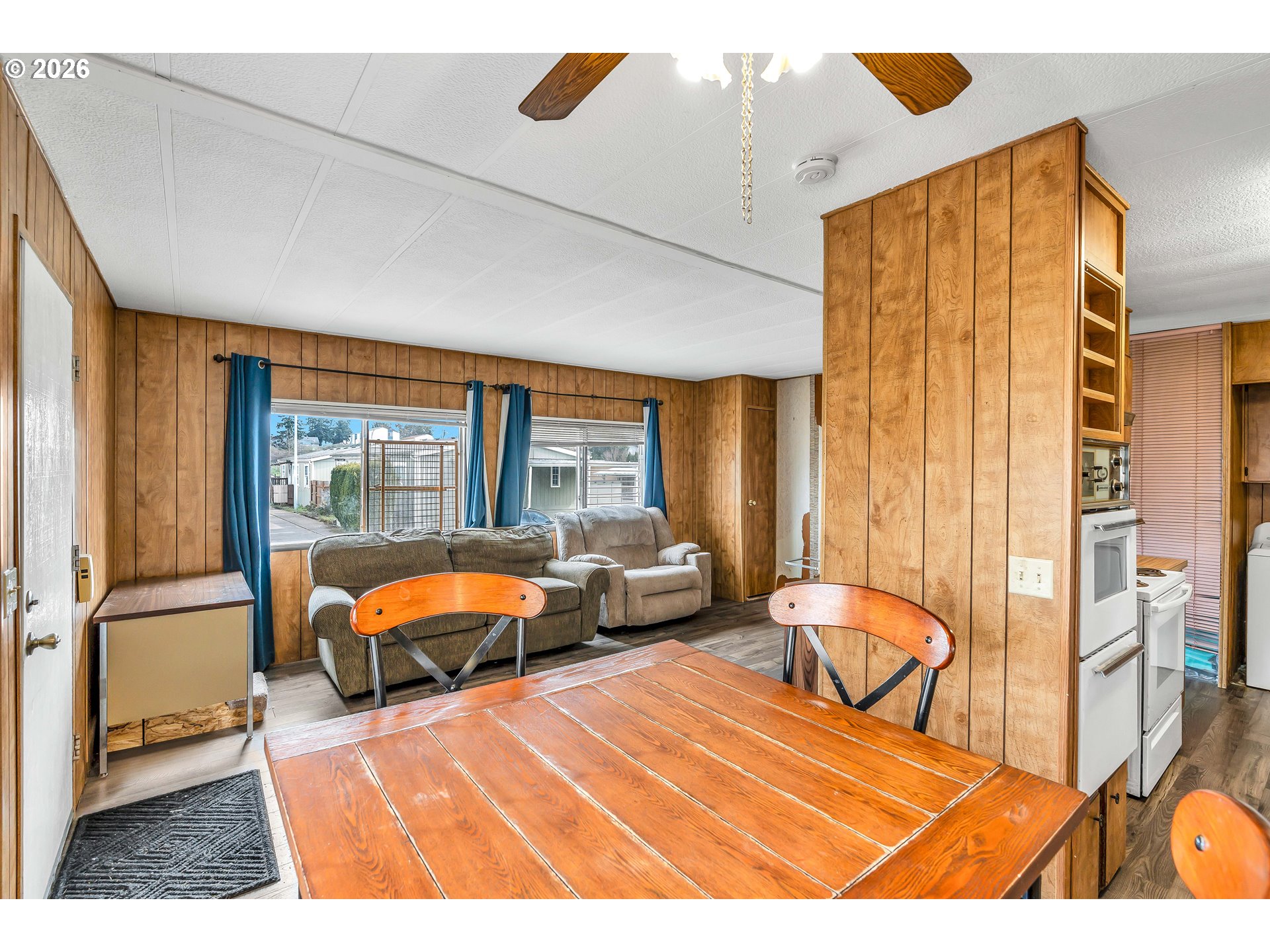 4783 Joyce Street, Unit 93 Keizer, OR 97303 - Photo 9 of 33 a bedroom with a bed and wooden floor
