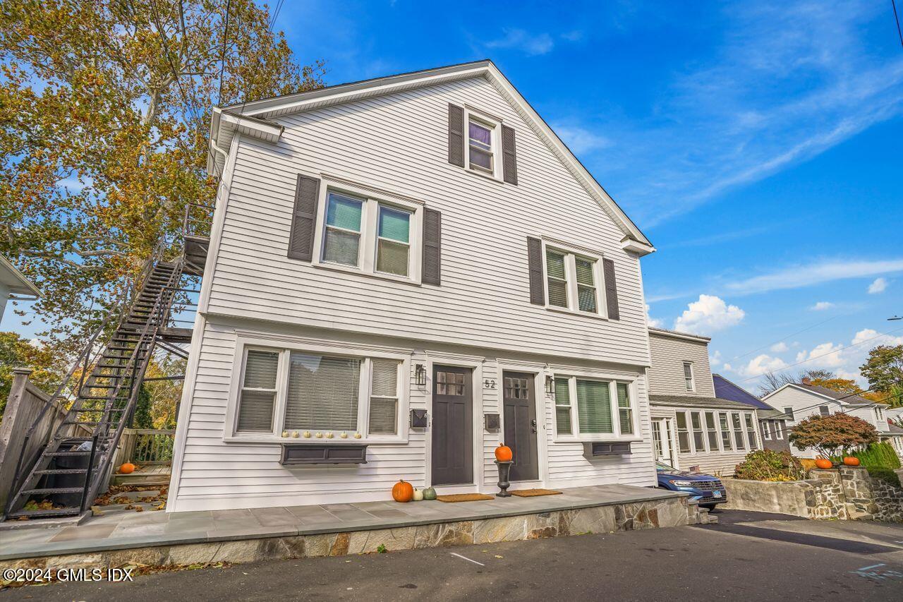 52 Le Grande Avenue, Unit 2 Greenwich, CT 06830 - Photo 1 of 31 a view of a house with a yard