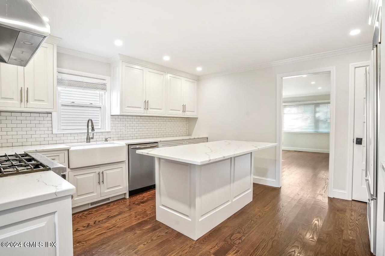 52 Le Grande Avenue, Unit 2 Greenwich, CT 06830 - Photo 2 of 31 a kitchen with a stove a sink and a refrigerator