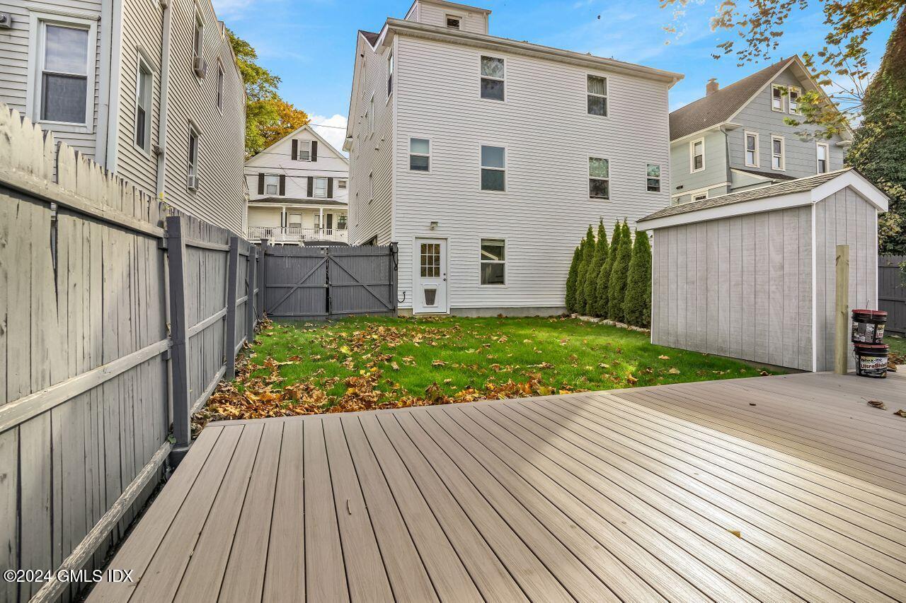 52 Le Grande Avenue, Unit 2 Greenwich, CT 06830 - Photo 22 of 31 a view of a house with a yard