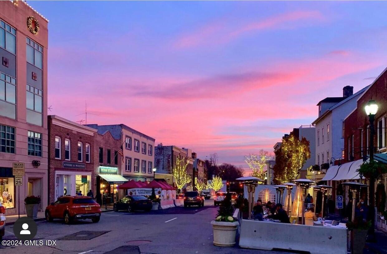 52 Le Grande Avenue, Unit 2 Greenwich, CT 06830 - Photo 26 of 31 a street view of building with cars parked