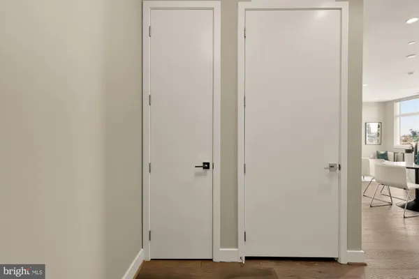 a view of room with wooden floor