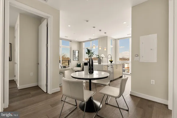 a view of a dining room with furniture and wooden floor