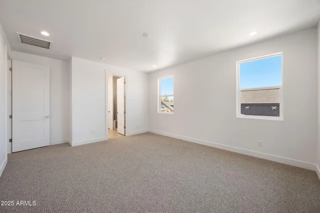 a bathroom with a sink double vanity and a mirror