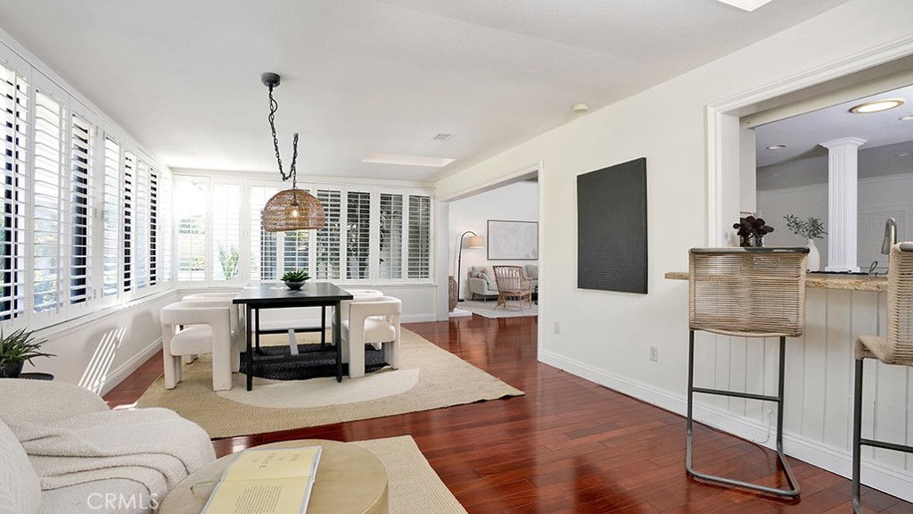 25312 Pizarro Road Lake Forest, CA 92630 - Photo 12 of 36 a living room with furniture a flat screen tv and wooden floor