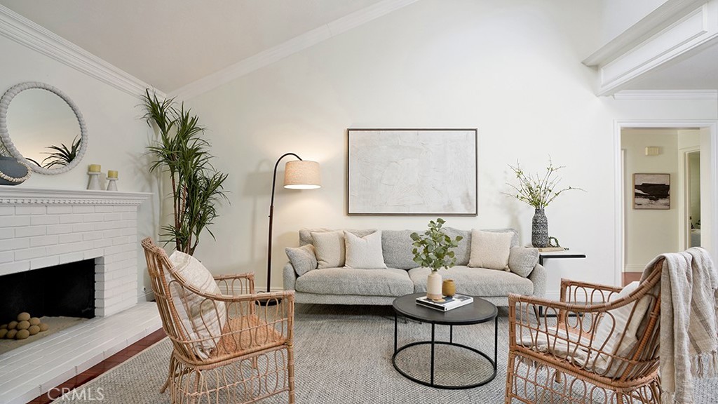 25312 Pizarro Road Lake Forest, CA 92630 - Photo 17 of 36 a living room with furniture a fireplace and a potted plant