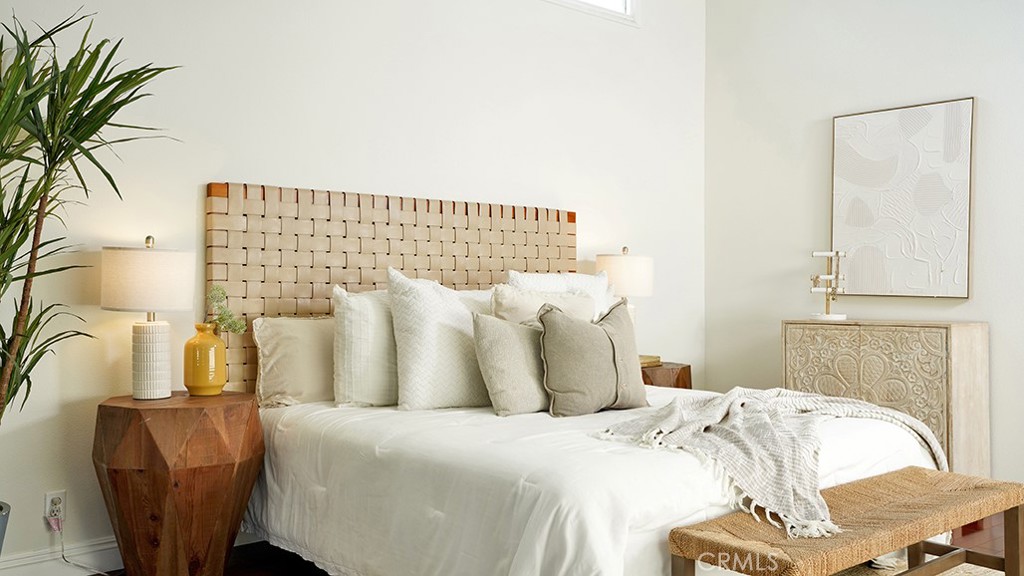 25312 Pizarro Road Lake Forest, CA 92630 - Photo 19 of 36 a bed sitting in a bedroom and with a chair