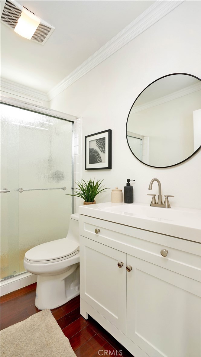25312 Pizarro Road Lake Forest, CA 92630 - Photo 20 of 36 a bathroom with a sink mirror vanity and toilet