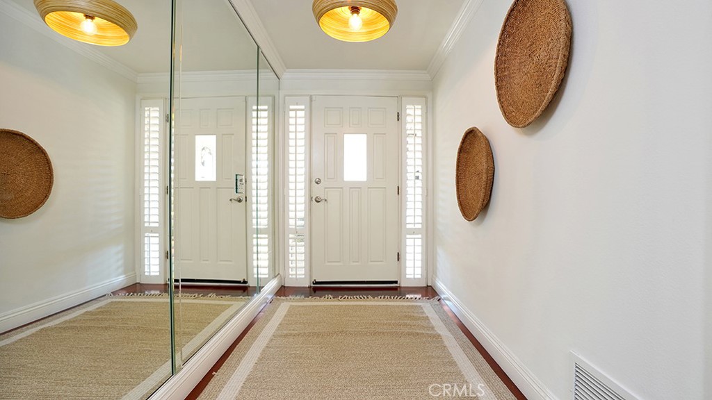 25312 Pizarro Road Lake Forest, CA 92630 - Photo 25 of 36 a view of a livingroom with painted walls and a floor to ceiling window