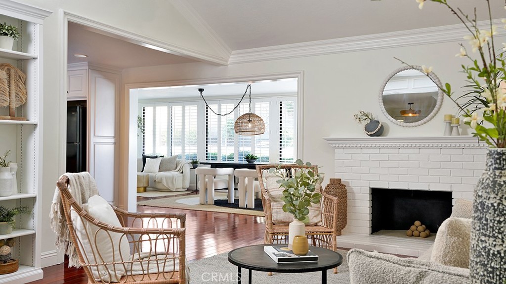 25312 Pizarro Road Lake Forest, CA 92630 - Photo 4 of 36 a living room with furniture a fireplace and a large window