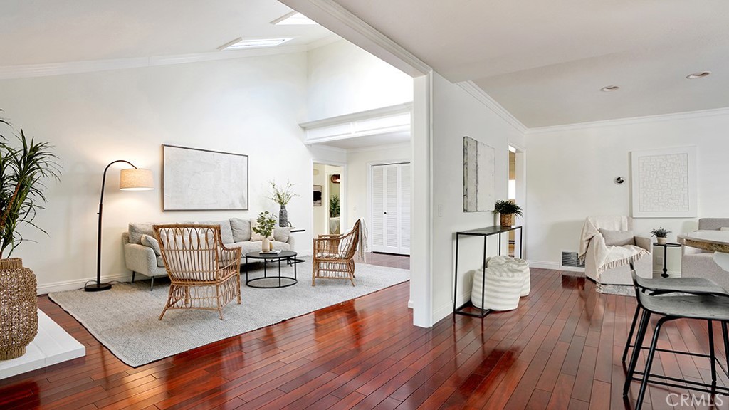 25312 Pizarro Road Lake Forest, CA 92630 - Photo 9 of 36 a living room with furniture a wooden floor and next to a window