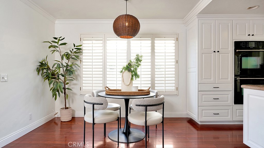 25312 Pizarro Road Lake Forest, CA 92630 - Photo 10 of 36 a view of a dining room with furniture and wooden floor