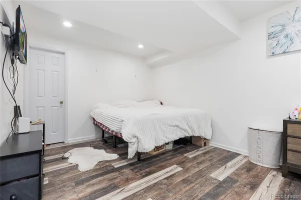 a bed room with a bed and a chair