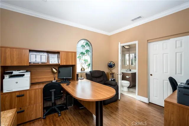 a living room with furniture a flat screen tv and a large window