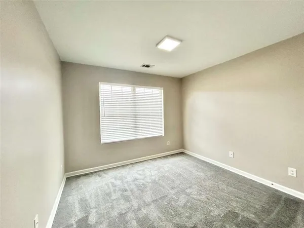 an empty room with a empty space and a window