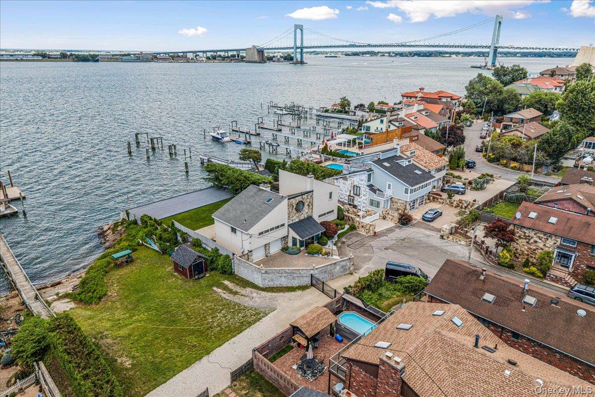 154-43 Riverside Drive Queens, NY 11357 - Photo 3 of 41 an aerial view of a house with a lake view