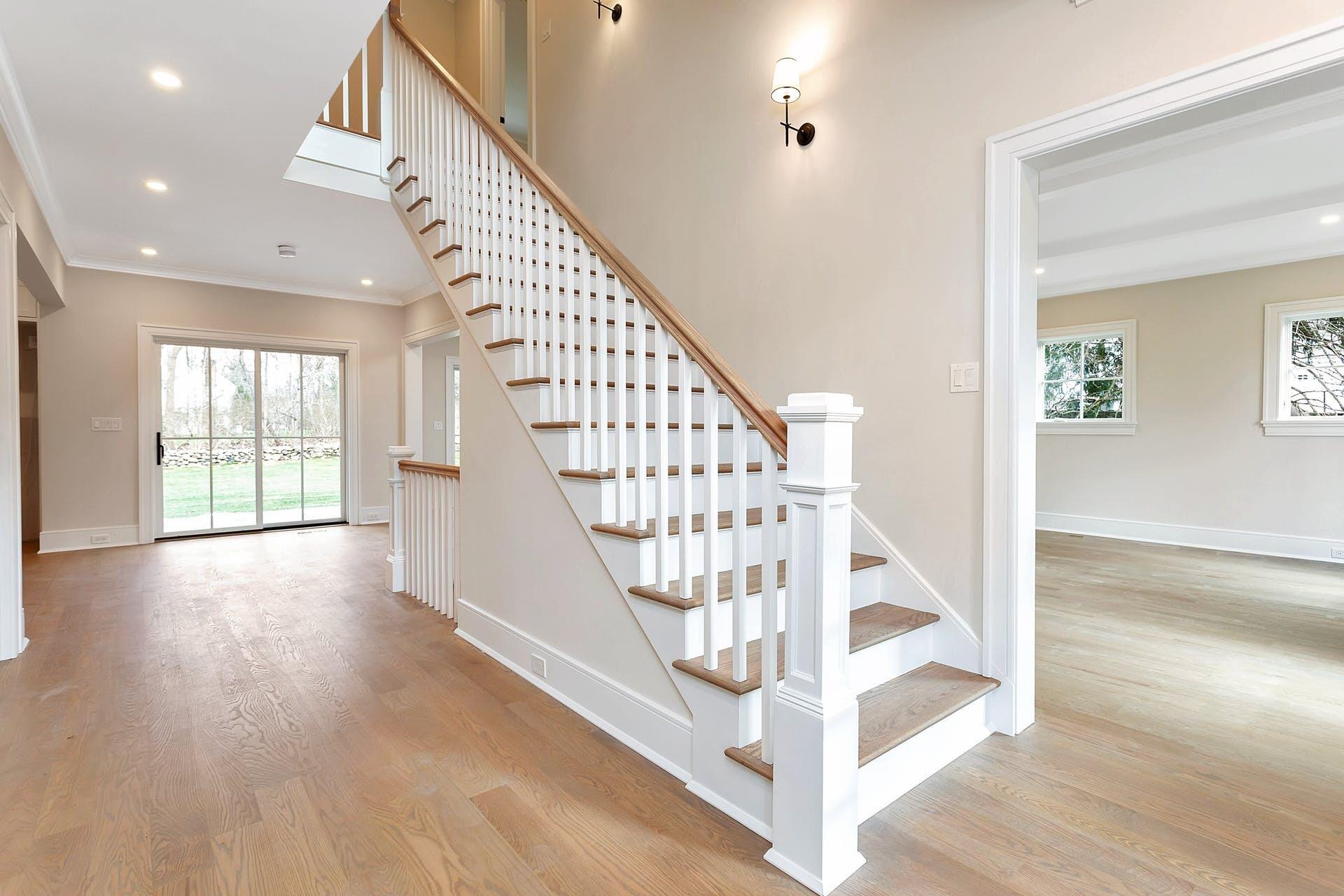 159 Middlesex Road Darien, CT 06820 - Photo 14 of 38 a view of entryway with wooden floor and stairs