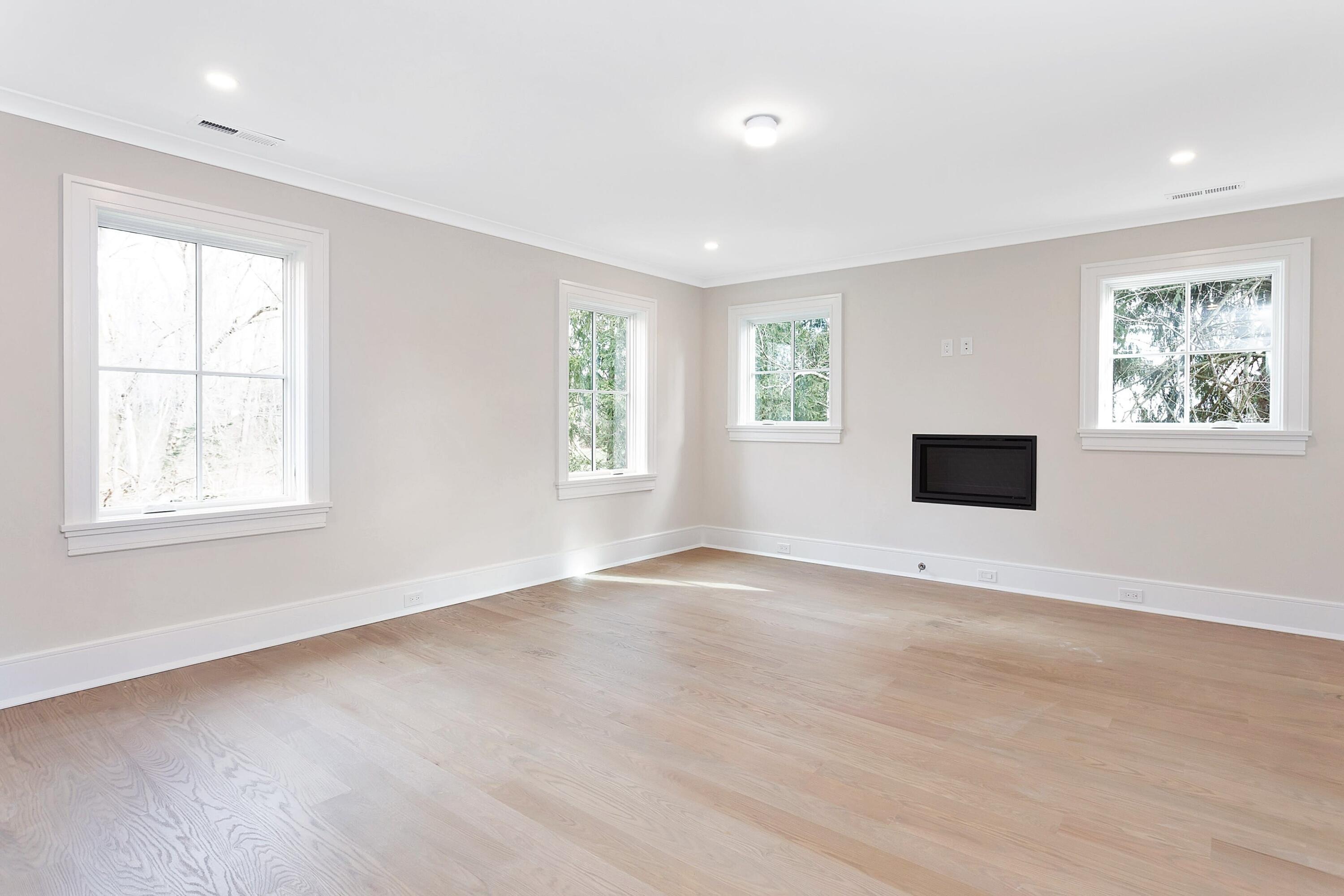 159 Middlesex Road Darien, CT 06820 - Photo 19 of 38 a view of an empty room with wooden floor and a window
