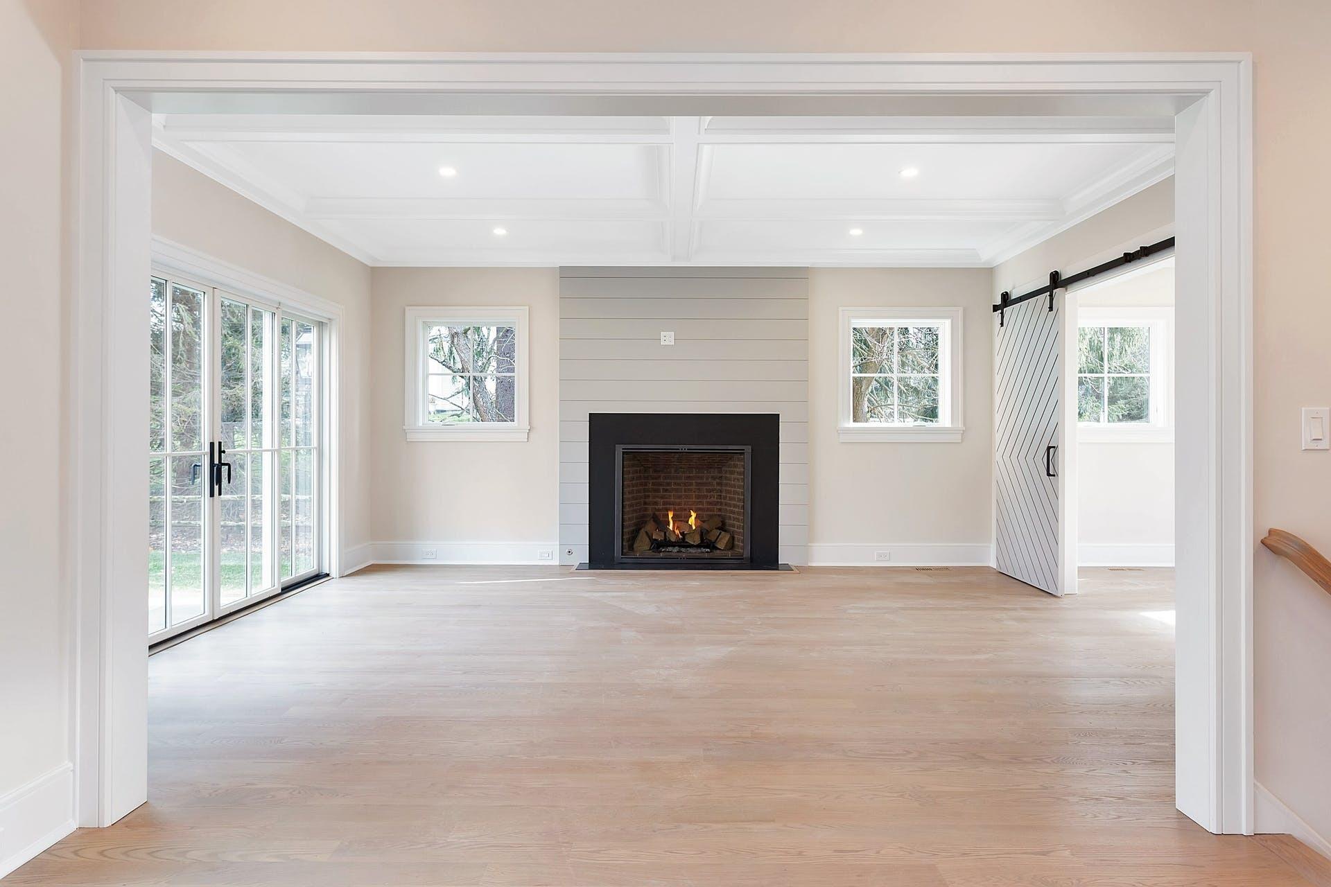 159 Middlesex Road Darien, CT 06820 - Photo 2 of 38 a view of an empty room with a fireplace and a window