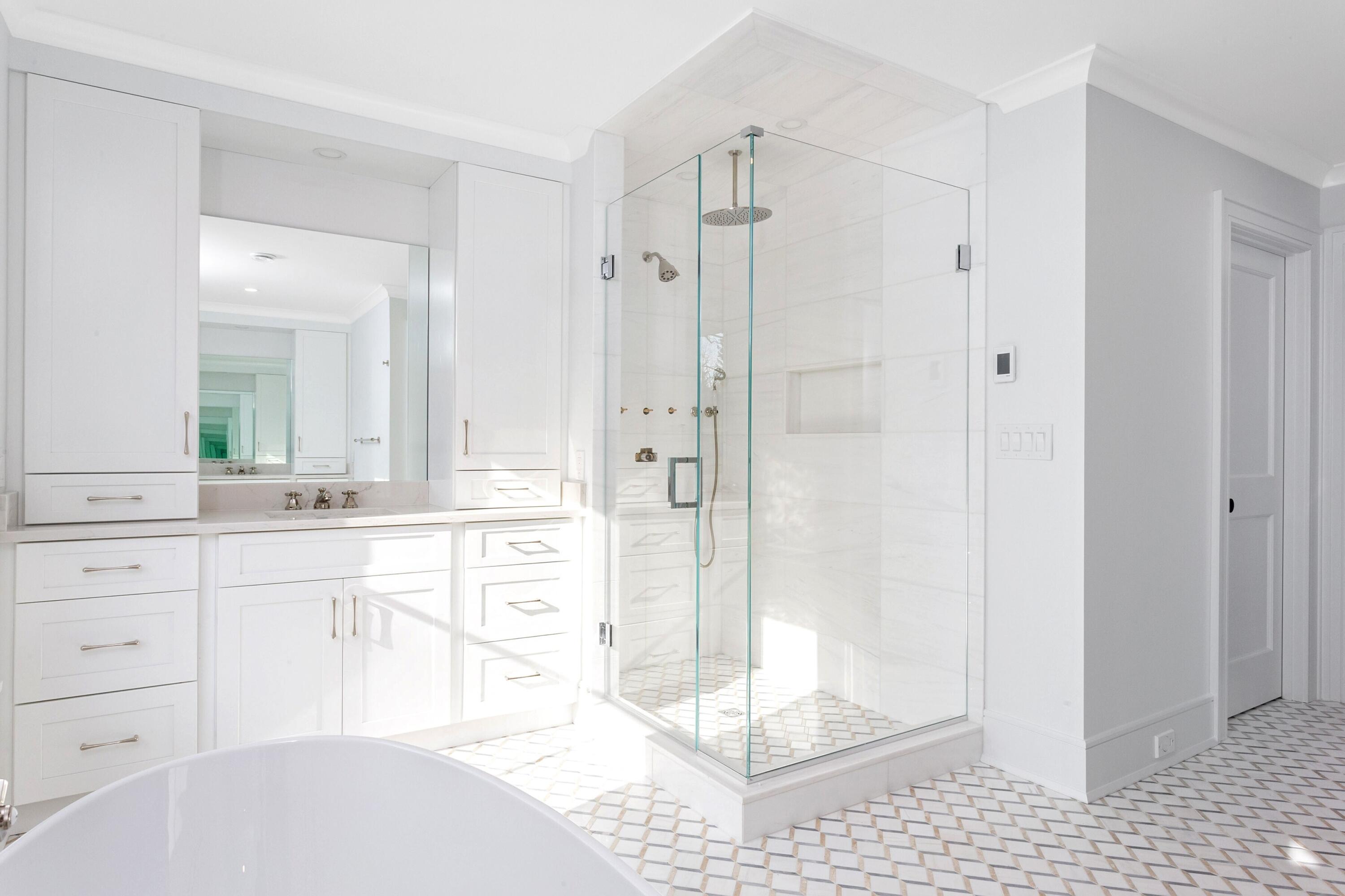 159 Middlesex Road Darien, CT 06820 - Photo 21 of 38 a bathroom with a shower sink and mirror