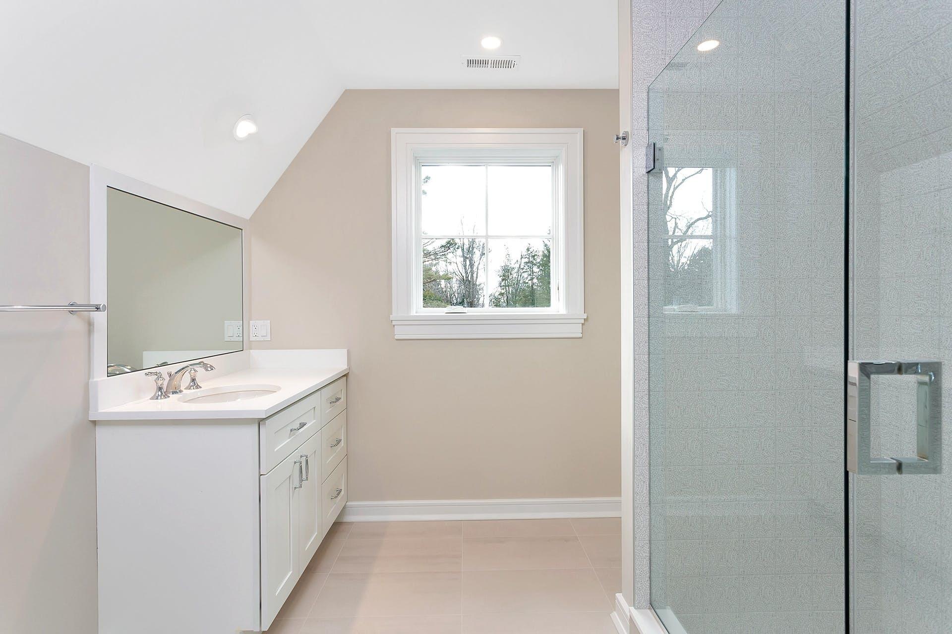 159 Middlesex Road Darien, CT 06820 - Photo 31 of 38 a bathroom with a sink a toilet and shower