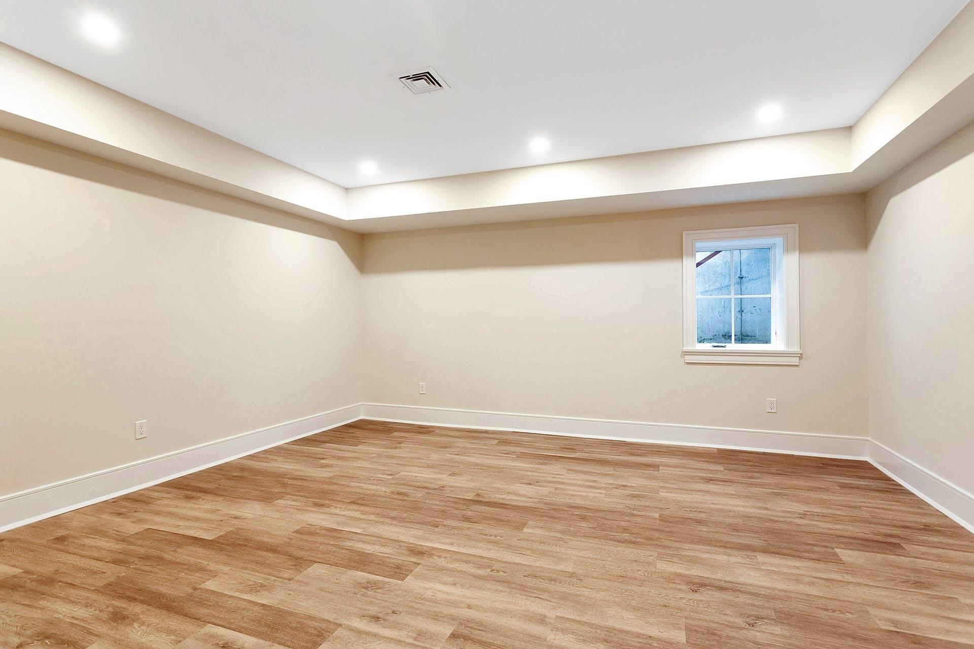 159 Middlesex Road Darien, CT 06820 - Photo 33 of 38 an empty room with wooden floor and windows