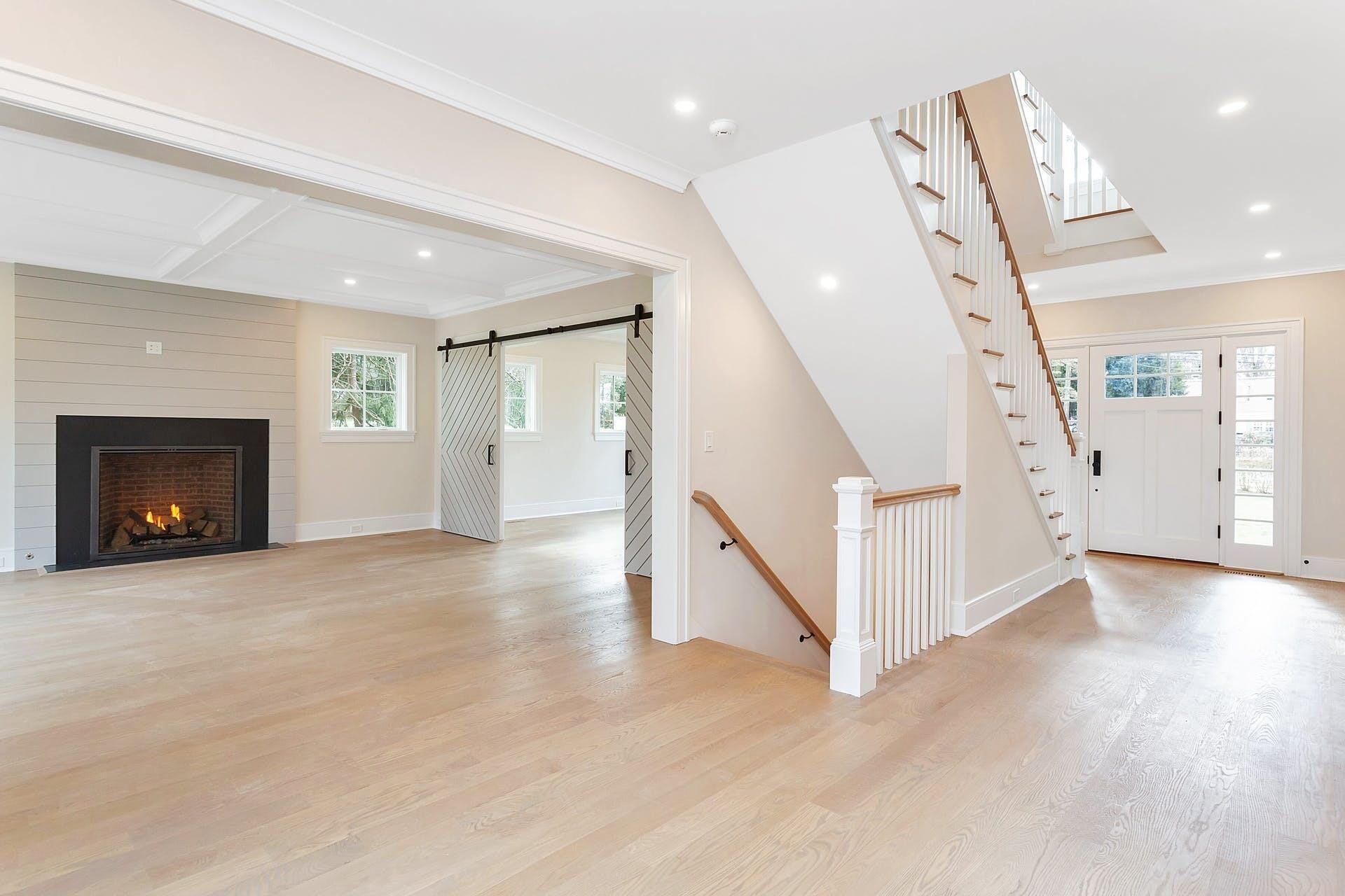 159 Middlesex Road Darien, CT 06820 - Photo 4 of 38 a view of an empty room with wooden floor and a fireplace