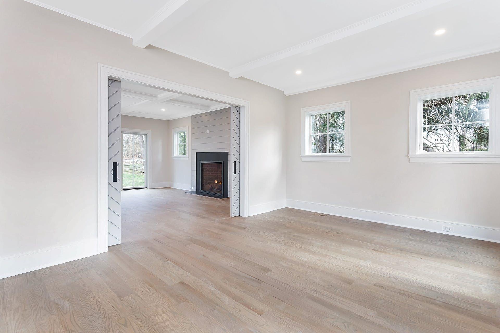 159 Middlesex Road Darien, CT 06820 - Photo 8 of 38 a view of empty room with wooden floor and fireplace