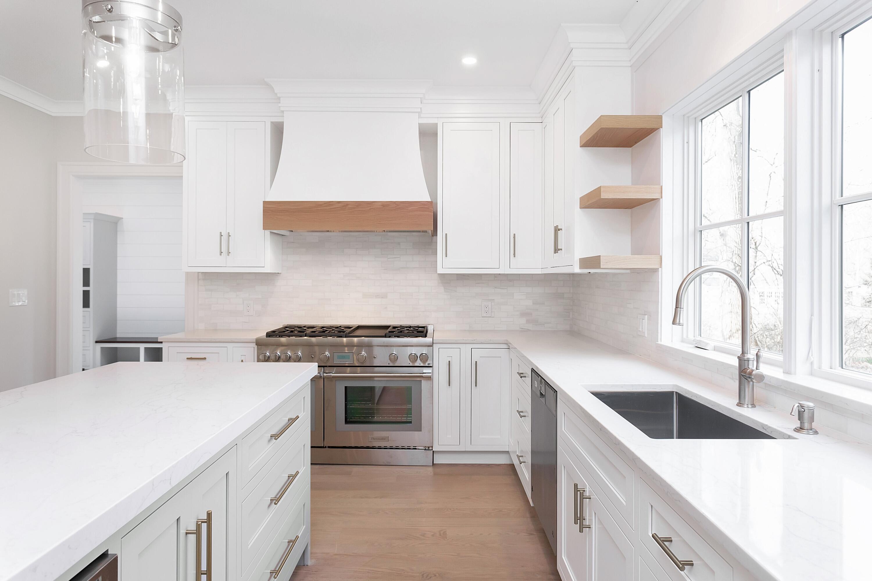 159 Middlesex Road Darien, CT 06820 - Photo 10 of 38 a kitchen with a sink stove top oven and cabinets
