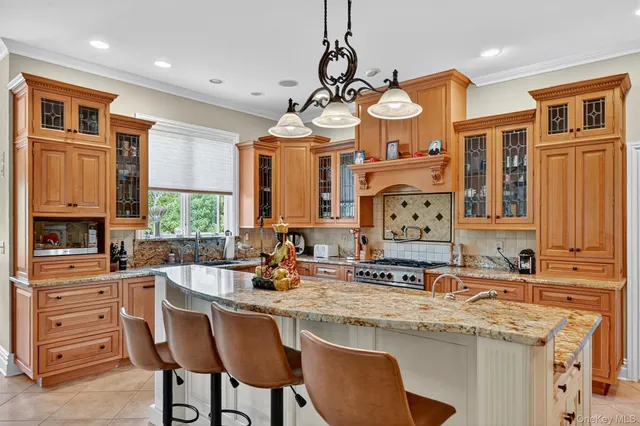 a kitchen with stainless steel appliances a sink and cabinets