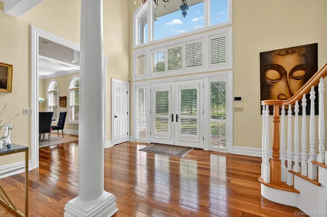 a view of livingroom with furniture wooden floor and windows