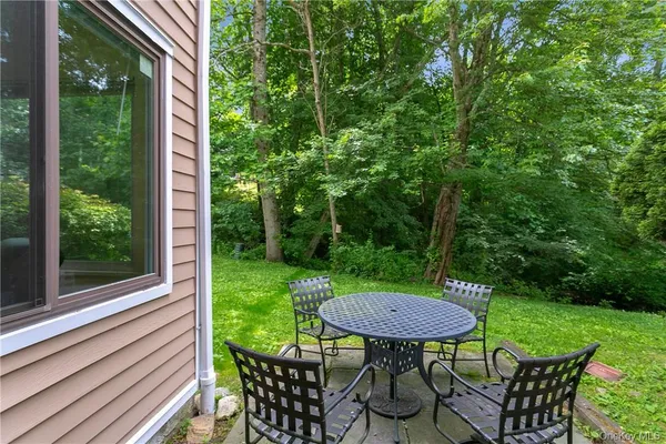 a view of a table and chairs in the garden