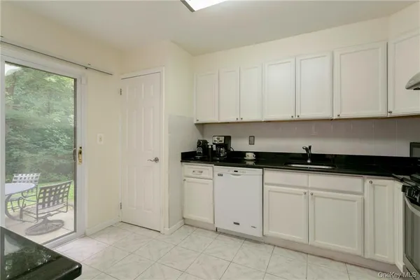 a kitchen with white cabinets