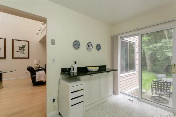 a hallway with a view of living room