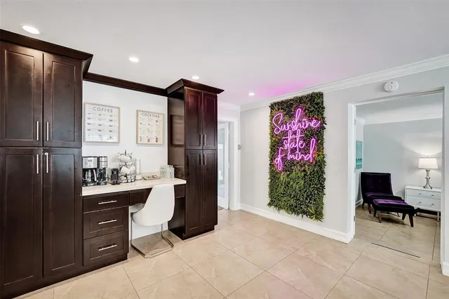a kitchen with refrigerator and cabinets