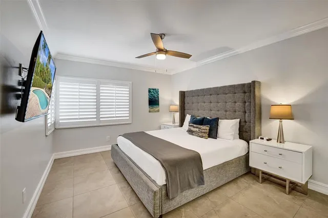 a bedroom with a bed and a night stand