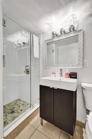 a bathroom with a sink double vanity and a mirror