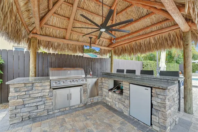 a view of a kitchen with a sink and cabinets