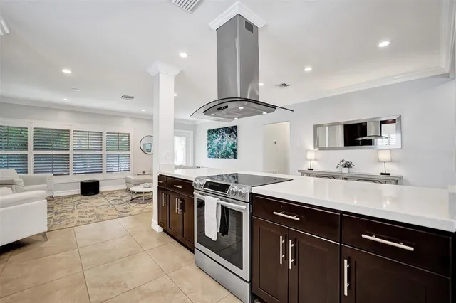 a kitchen with stainless steel appliances granite countertop a sink and a stove