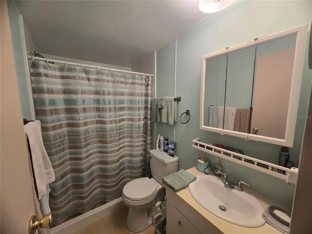 a view of a storage with a refrigerator