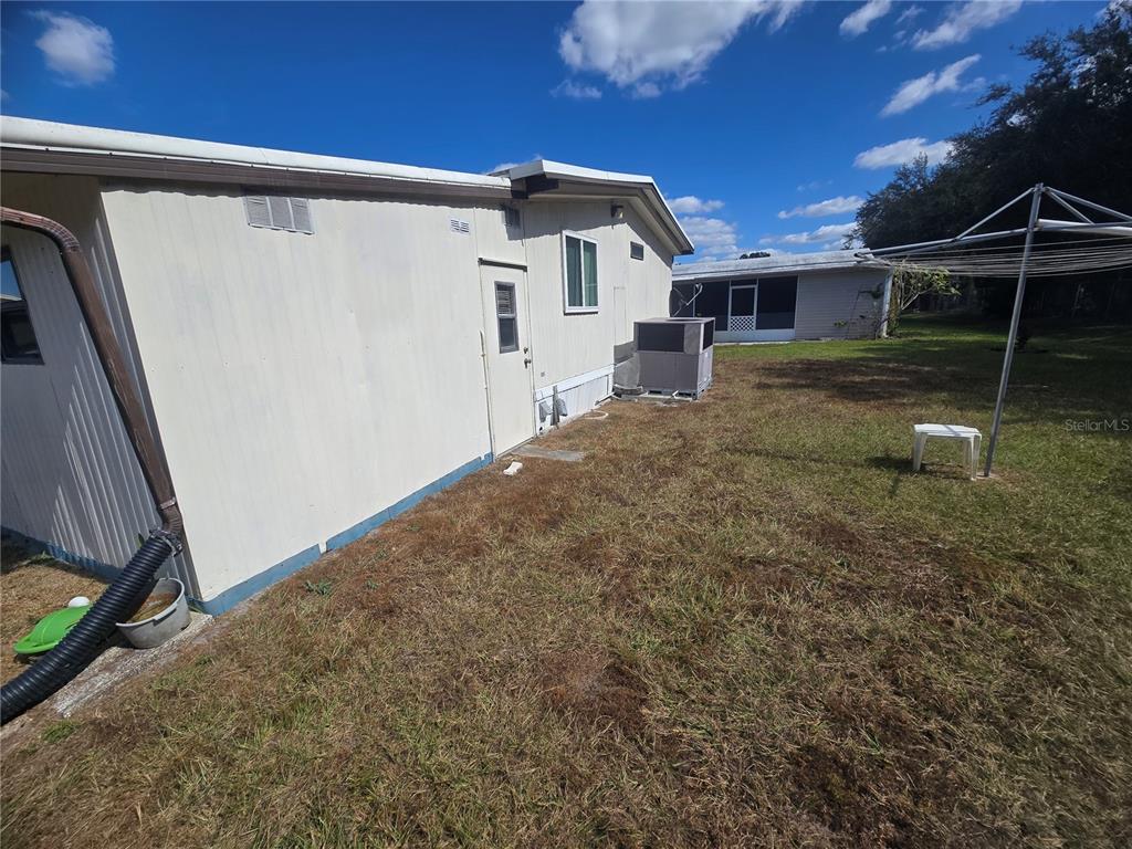 1710 7th Street Southwest, Unit 59 Ruskin, FL 33570 - Photo 21 of 31 a front view of a house with a yard