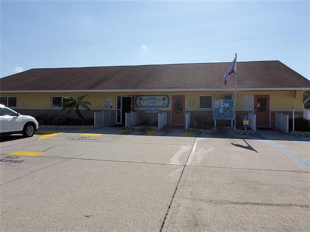 1710 7th Street Southwest, Unit 59 Ruskin, FL 33570 - Photo 24 of 31 a front view of house with yard