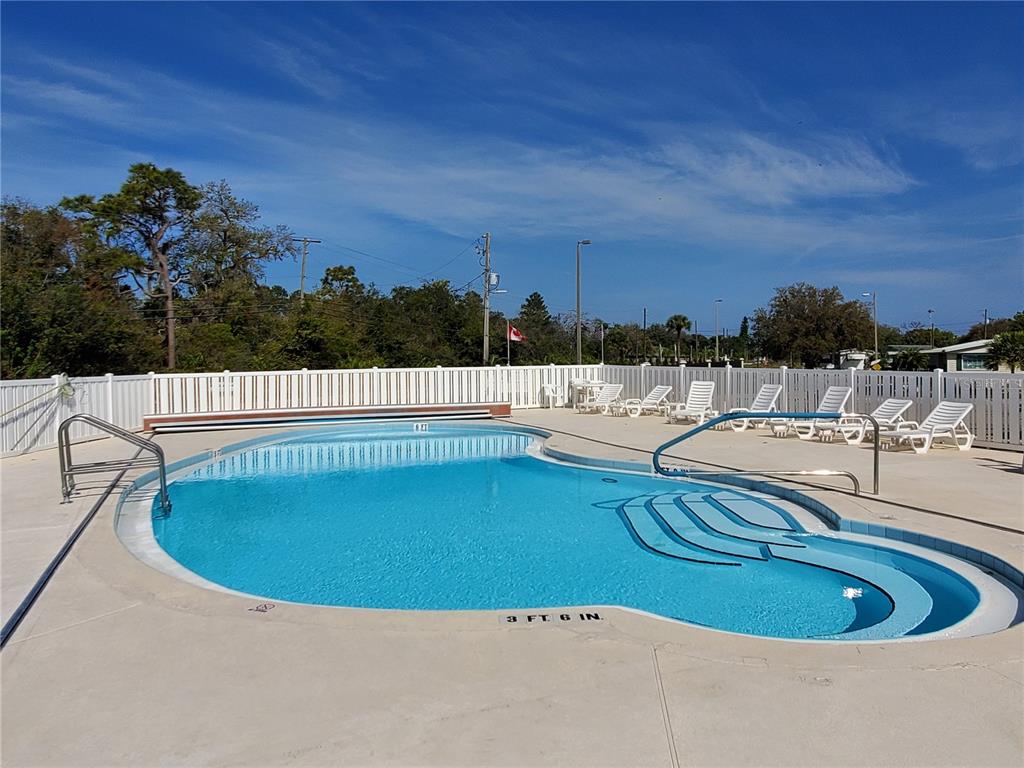 1710 7th Street Southwest, Unit 59 Ruskin, FL 33570 - Photo 26 of 31 a view of swimming pool and outdoor seating