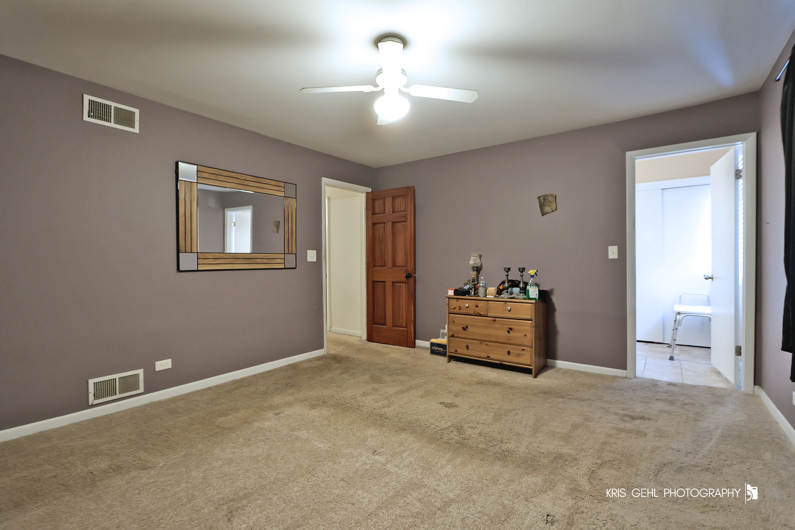 33312 North Lone Rock Road Grayslake, IL 60030 - Photo 11 of 25 a bedroom with a bed and a chandelier