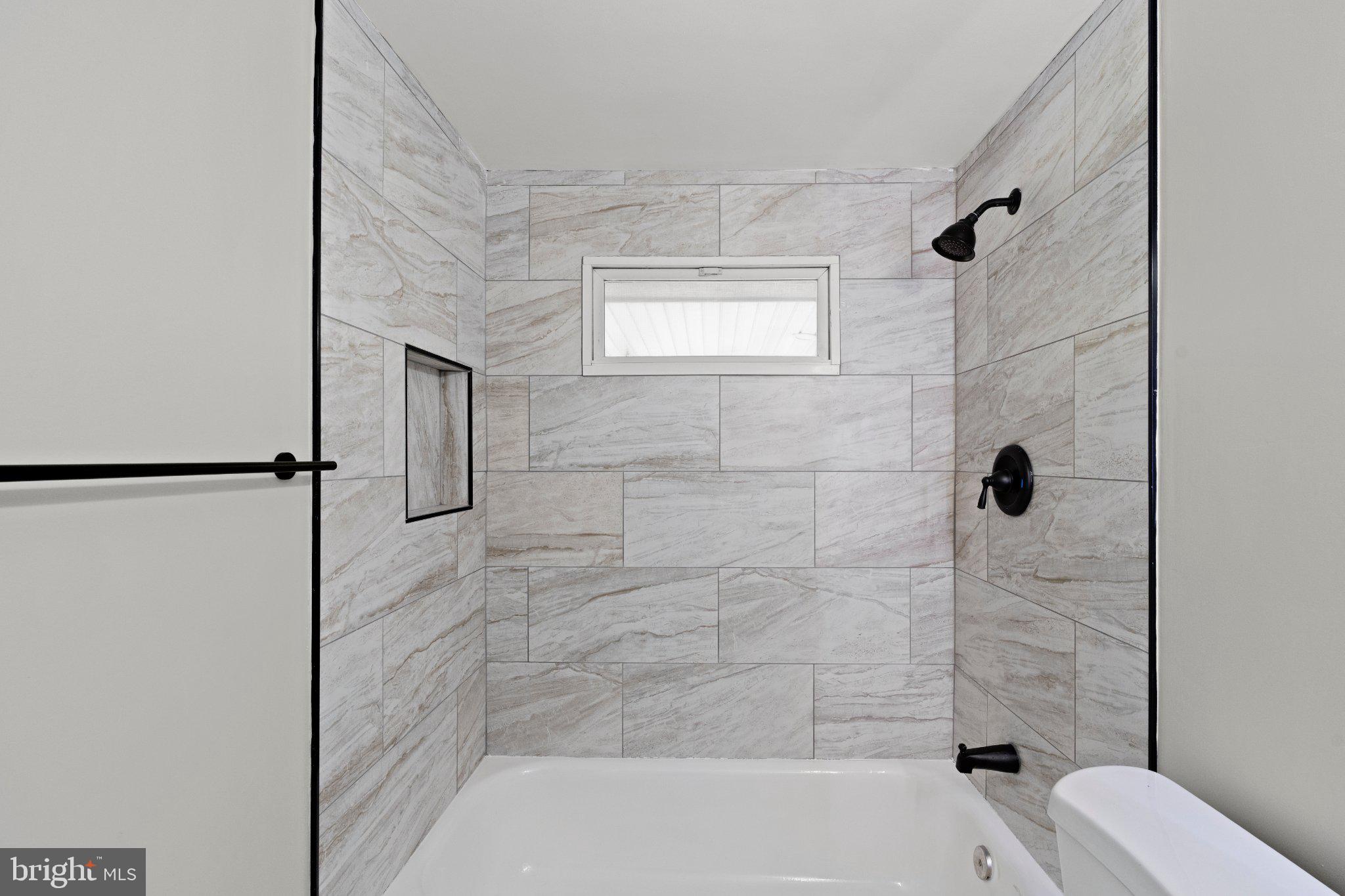 8405 Shirley Road Spotsylvania, VA 22551 - Photo 28 of 42 a bathroom with a shower and a toilet