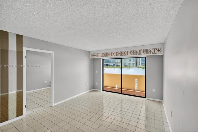 a view of an empty room and window